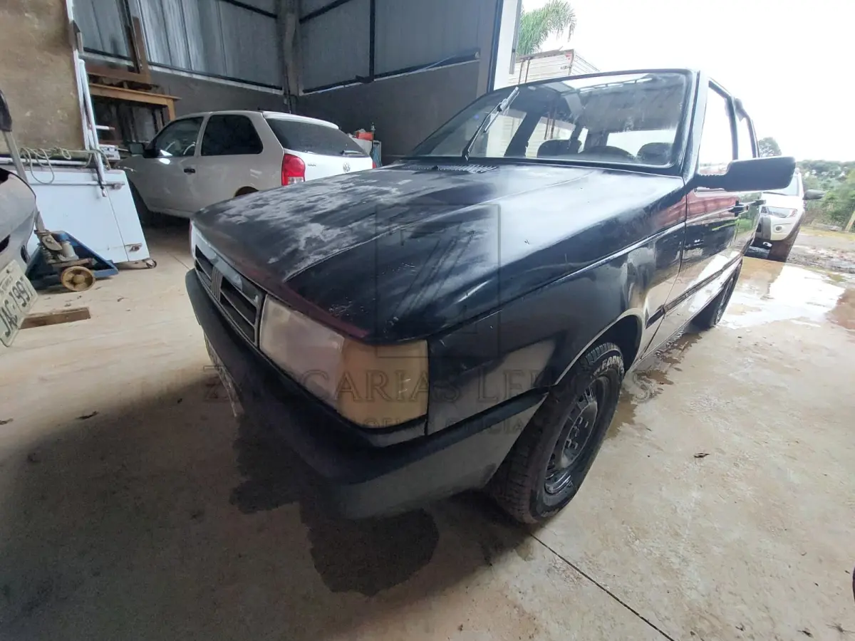 LOTE 008 - Um automóvel da marca FIAT/UNO ELETRONIC, placas IBM2392, ano/modelo 1994/1994, na cor  azul, à Gasolina, RENAVAM 617997535.