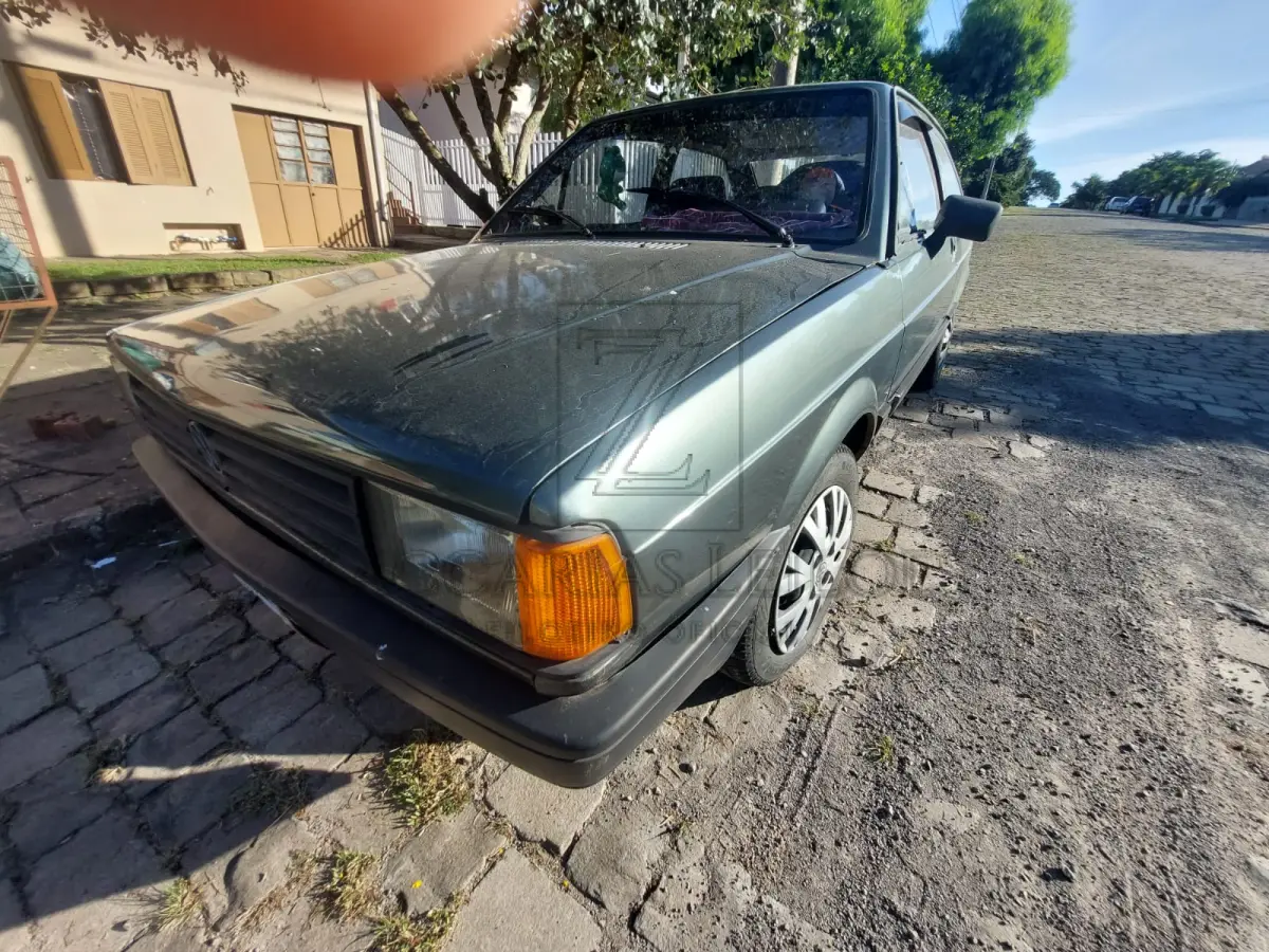 LOTE 011 - Um automóvel da marca VW-VOLKSWAGEN/GOL GL, placas IGU-1801, na cor verde, à  gasolina, ano/modelo 1987/1987, RENAVAM 562591583.