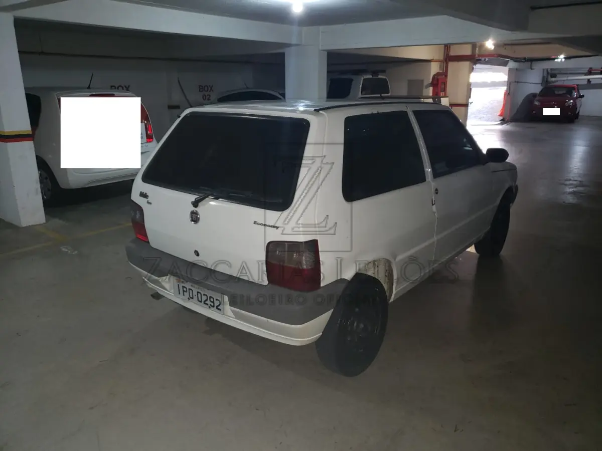 LOTE 006 - Um automóvel da marca FIAT/UNO MILLE ECONOMY, placas IPO0292, na cor branca, ano  modelo 2009/2009, RENAVAM 125795882.
