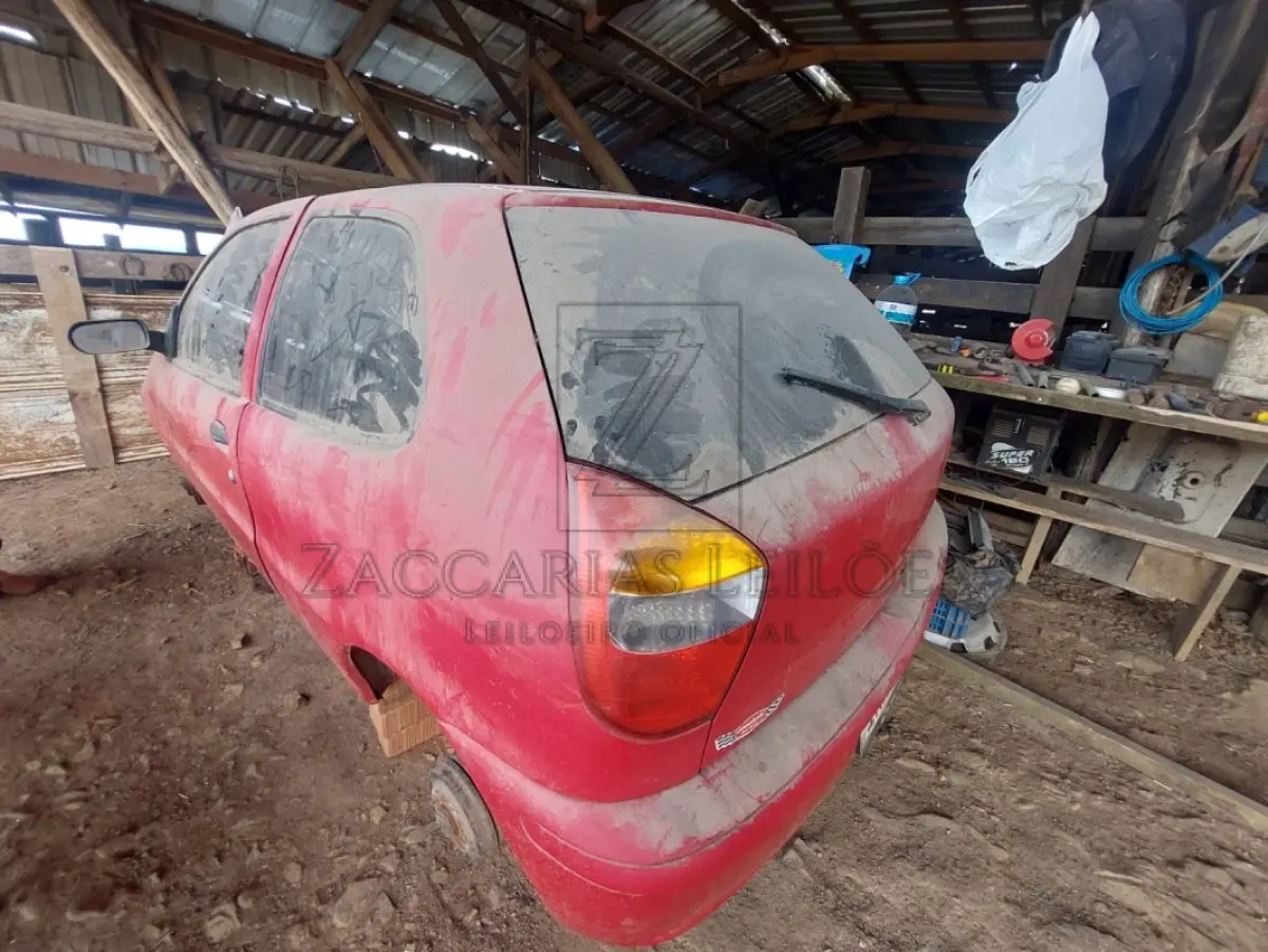 LOTE 010 - Um automóvel da marca FIAT/PALIO FIRE FLEX, placas IMX8A86, na cor vermelha, ano/modelo  2006/2006, RENAVAM 875658075.