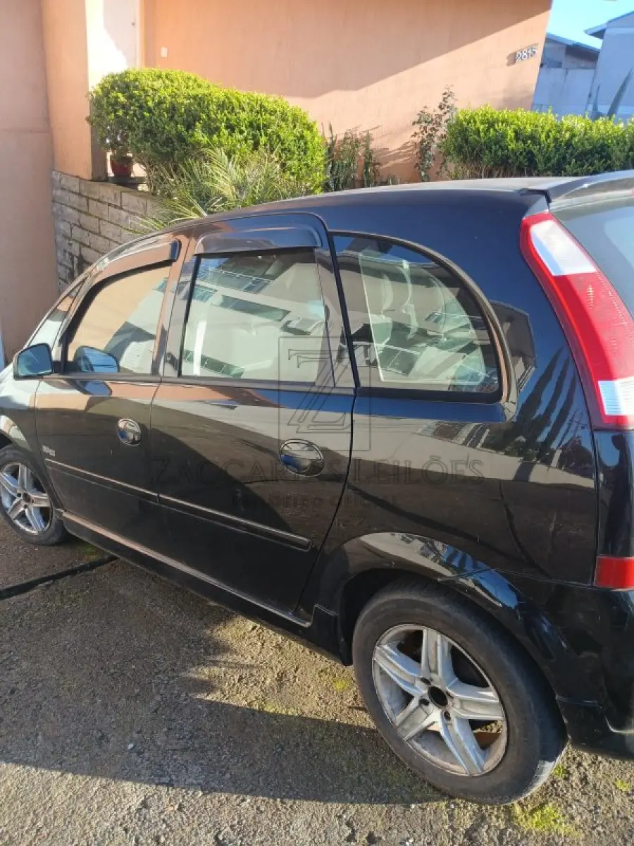 LOTE 004 - Um automóvel da marca GM/MERIVA MAXX placas INZ7251, na cor preta, ano/modelo 2007/2008,  à Álcool/Gasolina, RENAVAN 928515001. Reserva de 50% da cota referente à meação.