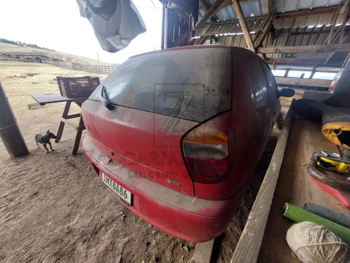 LOTE 010 - Um automóvel da marca FIAT/PALIO FIRE FLEX, placas IMX8A86, na cor vermelha, ano/modelo  2006/2006, RENAVAM 875658075.